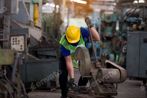 Preview: Male Worker Working With Metal Cutting Saws. Asian Male Engineer Worker Working On Cutting Metal