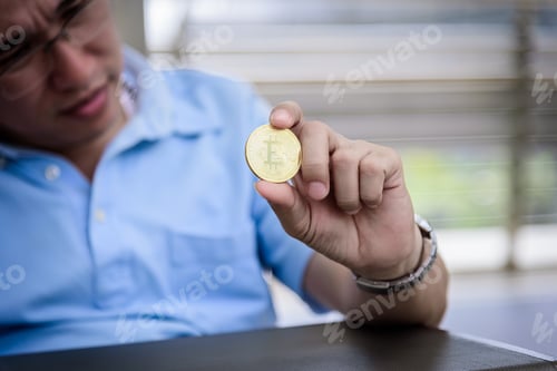 Preview: Adisn Business Man Sitting In Depression With Bit Coin Money.