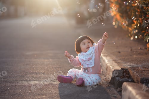 Preview: Portrait Of Cute Baby In The Sunset Evening