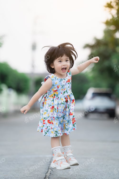 Preview: Happy Cute Girl Smiling And Jumping On The Road