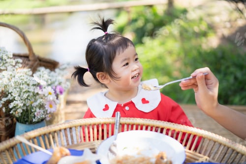 Preview: Cute Baby Eating On The Wood Table