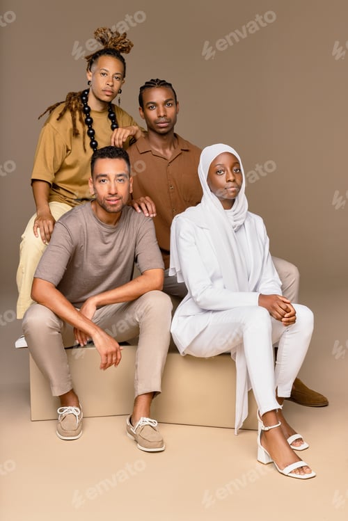 Preview: Group Of Four People With Diverse Ethnicities And Abilities Posed On A Neutral Background