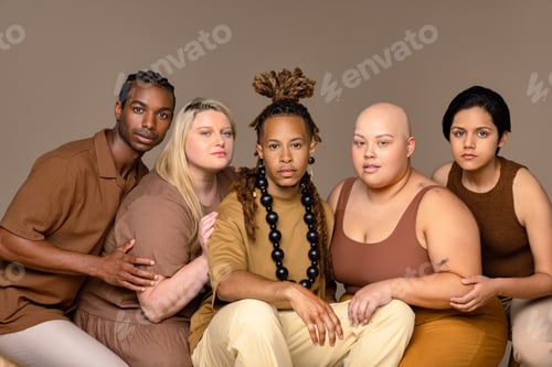 Preview: Portrait Of A Chic Multiracial Group Of People Looking At The Camera On A Neutral Background.