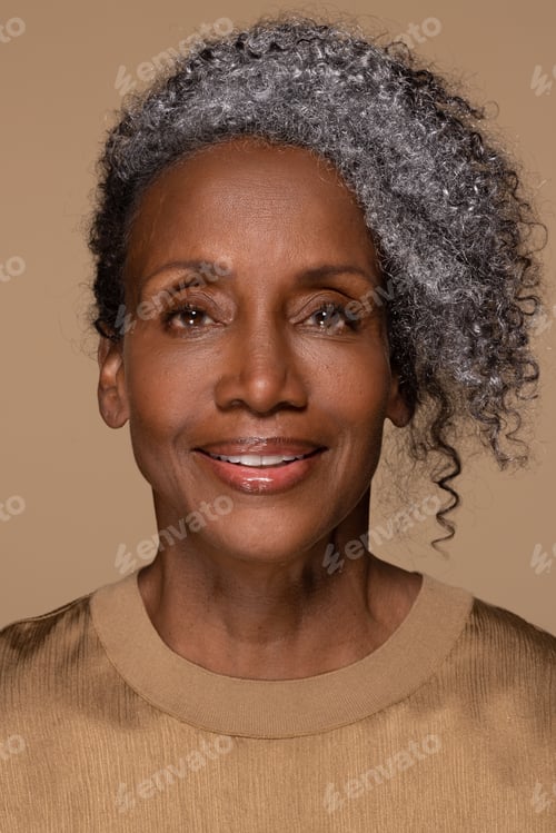 Preview: Close Up Portrait Of Beautiful Black Woman In Her Late 50S Smiling Happy With Perfect Skin And