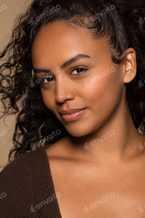 Preview: Close Up Portrait Of Beautiful Hispanic Woman In Her 20S Posing On Neutral Background