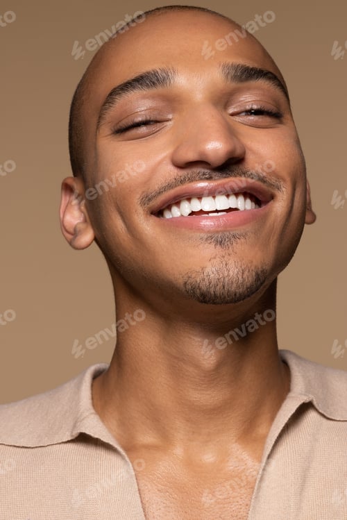 Preview: Portrait Of Beautiful Hispanic Man In His 20S Posing On Neutral Background