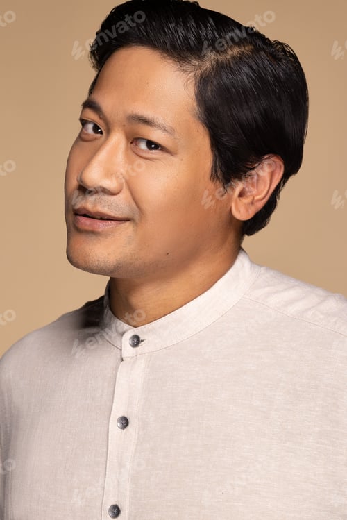 Preview: Portrait Of Handsome Chinese Man In His 30S Smiling And Posing Confidently On Neutral Background