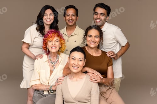 Preview: Studio Shot Of A Group Of Beautiful Multiracial People Smiling At The Camera On A Neutral