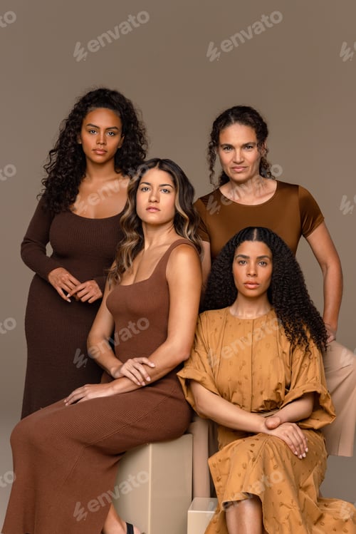 Preview: Four Women Posing in Brown Outfits Indoors