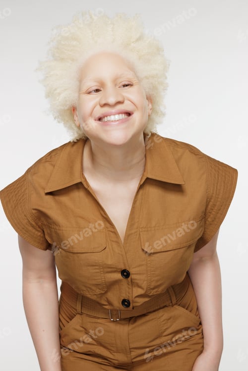Preview: Three Quarter Length Shot Of Beautiful Black Non-Binary Person With Albinism In Their 20S Posing On
