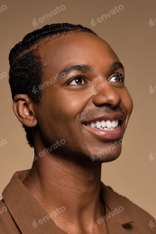 Preview: Close Up Portrait Of Attractive Young Black Man In His 20S Posing With Confidence On Neutral