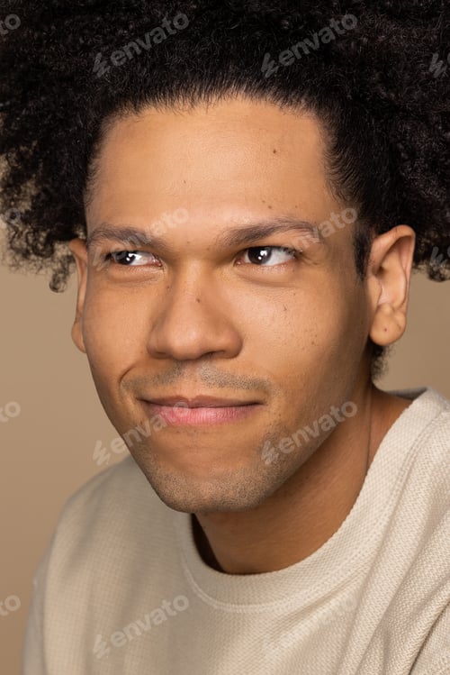 Preview: Profile Shot Of A Gorgeous Biracial Man In His 30'S Smiling And Looking To The Side On A Neutral