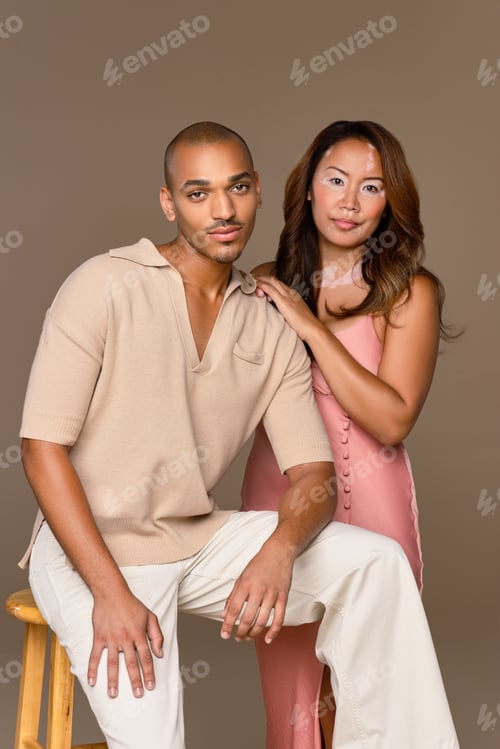Preview: Portrait Of A Southeast Asian Woman In Her 30'S With Vitiligo And A Hispanic Man In His 20'S