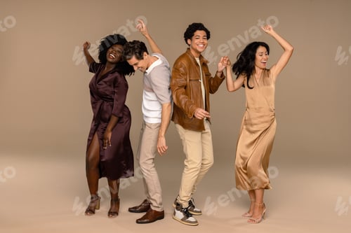 Preview: Studio Portrait Of A Group Of Beautiful Multiracial People Dancing Together On A Neutral Background.