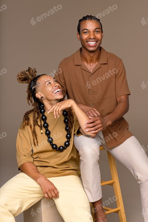 Preview: Studio Portrait Of Two Handsome Models In Their 20S With Diverse Ethnicities Posed Smiling On A