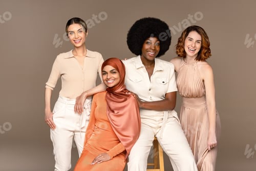 Preview: Studio Shot Of A Group Of Gorgeous Multiracial Women Smiling At The Camera On A Neutral Background.