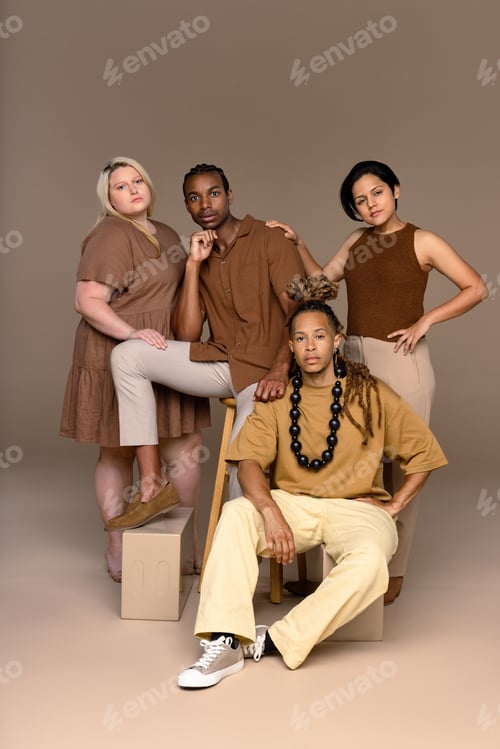 Preview: Group Of Four Ethnically Diverse People In Their 20S And 30S Posed Smiling On A Neutral Background