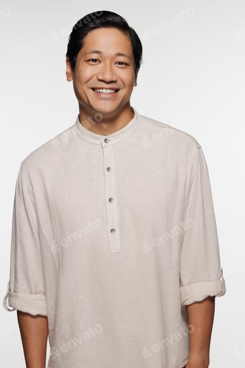 Preview: Three Quarter Length Shot Of Chinese Man In His 30S Smiling And Posing On White Background