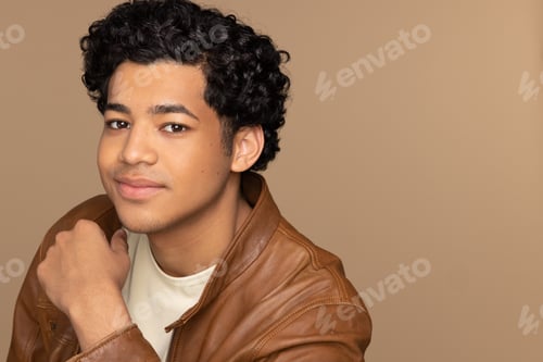 Preview: Profile Of A Gorgeous Multiracial Man In His 20'S Smiling At The Camera On A Neutral Background.