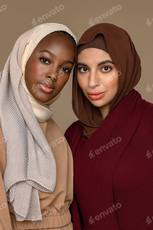 Preview: Studio Shot Of An Afro-Arab Woman In Her 20'S And An Arab Muslim Woman In Her 20'S Smiling At The