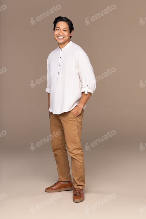 Preview: Full Length Shot Of Chinese Man In His 30S Smiling And Posing Confidently On Neutral Background