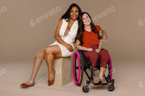 Preview: Full Length Shot Of A Black Woman In Her 20'S With An Amputated Leg And A Caucasian Woman In Her