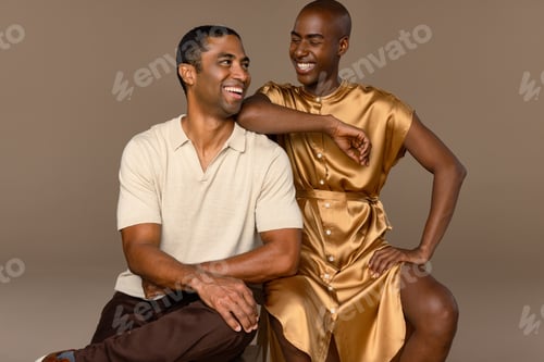 Preview: Portrait Of A Biracial Man In His 40'S And A Rwandan Man In His 20'S Laughing Together On A Neutral