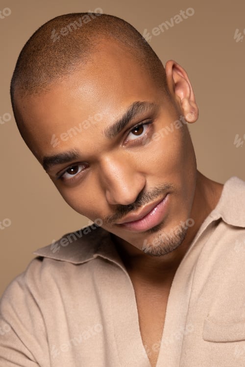 Preview: Portrait Of Beautiful Hispanic Man In His 20S Posing On Neutral Background