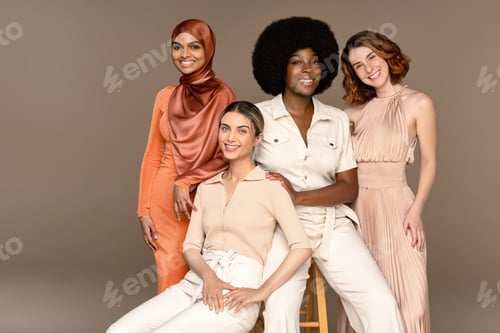 Preview: Portrait Of A Group Of Gorgeous Multiracial Women Smiling On A Neutral Background.