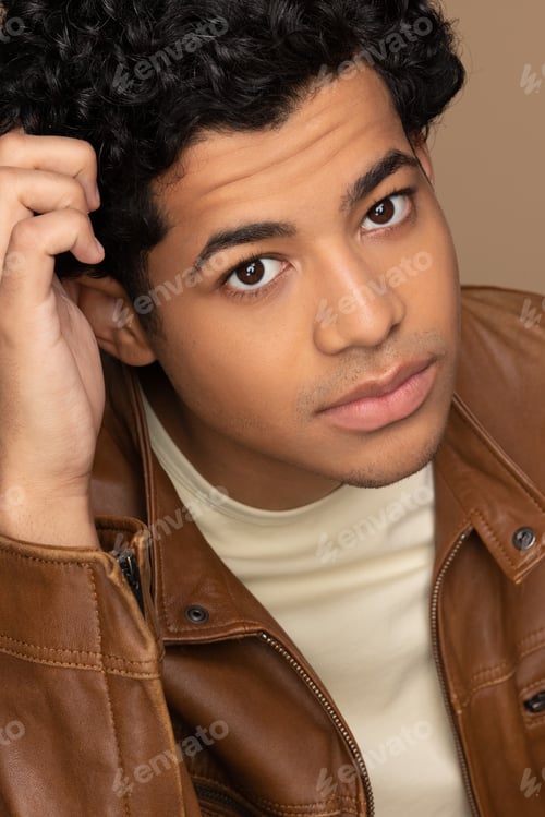Preview: Studio Portrait Of An Attractive Multiracial Man In His 20'S Looking At The Camera On A Neutral