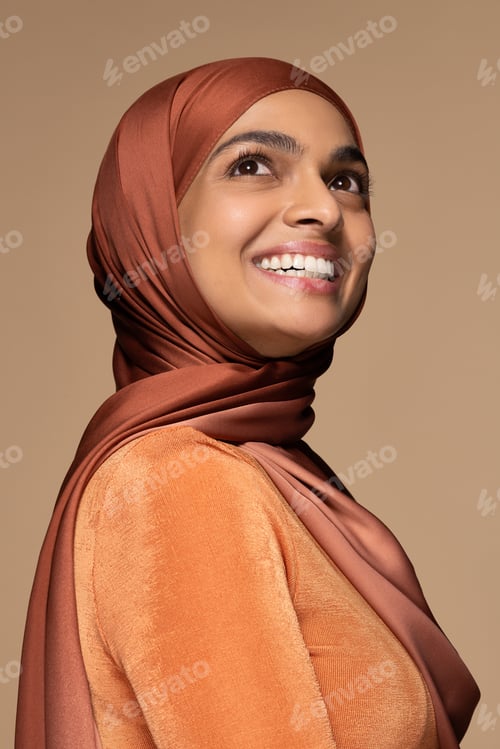Preview: Portrait Of Beautiful South Asian Woman In Her 20S Wearing A Hijab Posing Confidently On Neutral