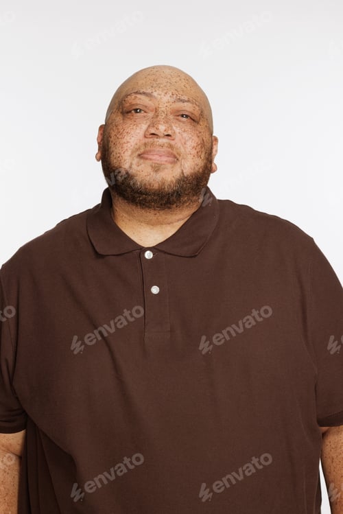 Preview: Portrait Of A Gorgeous Multiracial Man In His 50'S Standing Confidently On A White Seamless.