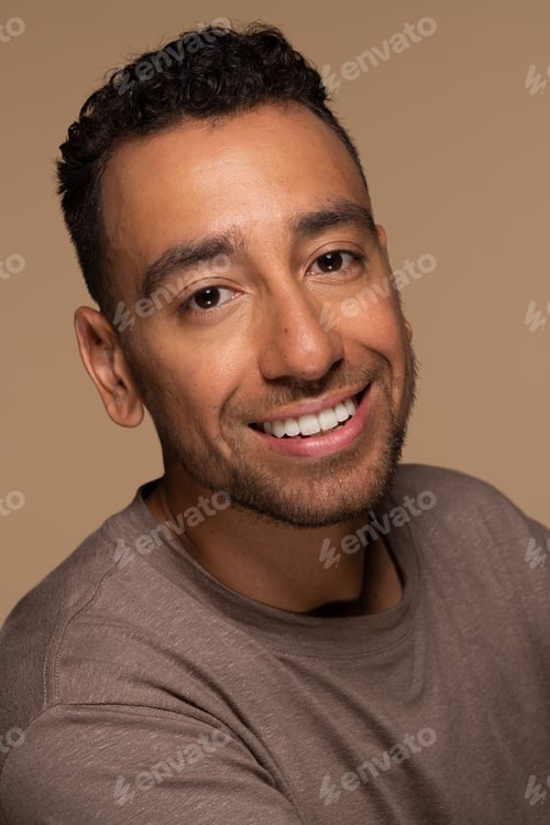 Preview: Portrait Of Attractive Hispanic Man In His 30S Smiling And Posing On Neutral Background