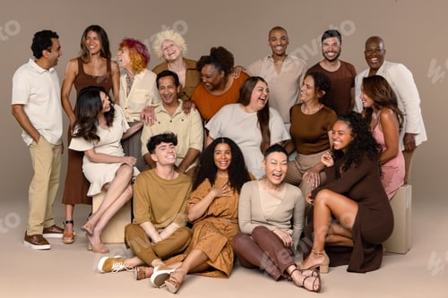 Preview: Studio Shot Of A Group Of Beautiful Multiethnic People Laughing Together On A Neutral Background.