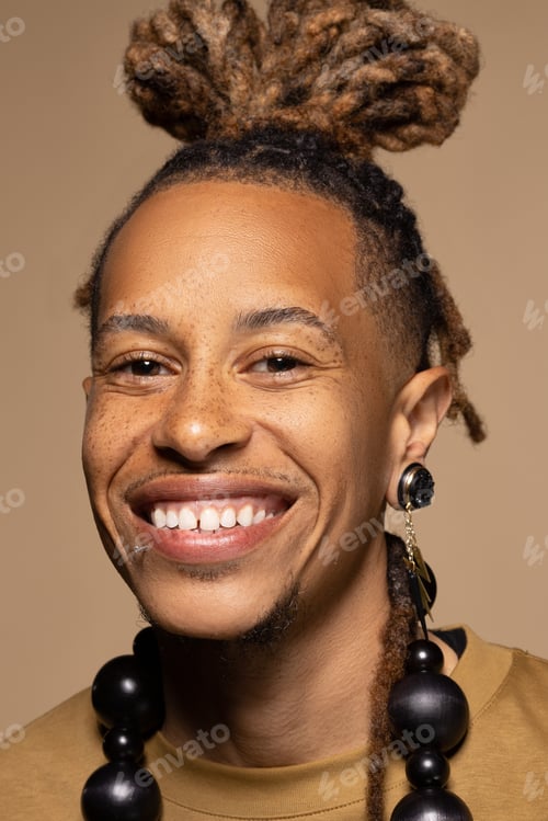 Preview: Portrait Of Fashionable Black Man In His 30S Posing Confidently In Studio Shot On Neutral Background