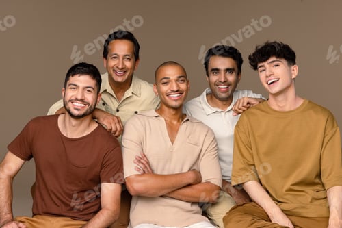 Preview: Portrait Of A Group Of Multiracial Men Laughing Together On A Neutral Background.