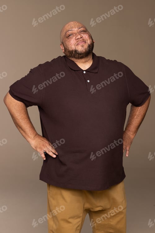 Preview: Portrait Of A Gorgeous Multiracial Man In His 50'S Posing Confidently On A Neutral Background.