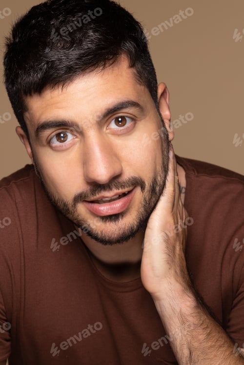 Preview: Portrait Of Attractive Hispanic Man In His 30S Posing Confidently On Neutral Background