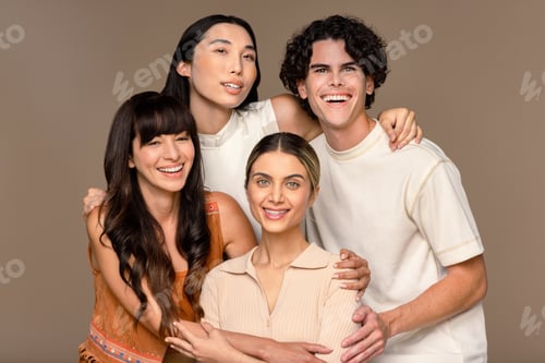 Preview: Close-Up Studio Portrait Of A Diverse Group Of Four People Smiling On A Neutral Background