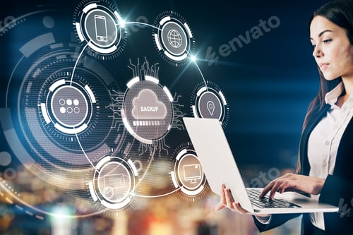 Preview: Attractive Businesswoman Using Laptop With Creative Glowing Cloud Computing Interface On Blurry