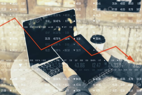 Preview: Close Up Of Hands Using Tablet With Financial Digits And Downward Red Arrow At Desk With Laptop And