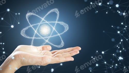 Preview: Hand Holding Creative Atom On Blue Background. Science And Future Concept