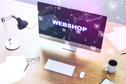 Preview: Close Up Of Office Desktop With Computer Monitor, Creative Webshop Inscription On Screen, Coffee