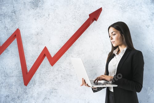 Preview: Businesswoman Using Laptop And Drawing Red Arrow On Concrete Wall. Leadership And Challenge Concept