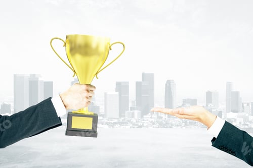 Preview: Businessman Handing Golden Cup Trophy To Another Man On City Background. Mock Up