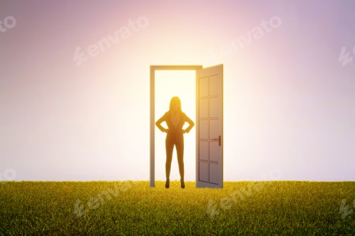 Preview: Successful Businesswoman Standing In Front Of Bright Door In Abstract Interior With Concrete Wall