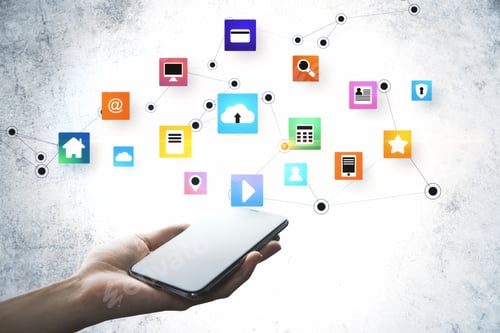 Preview: Hand Holding Mobile Phone With Glowing Online Networking Cloud Icons On Concrete Wall Background
