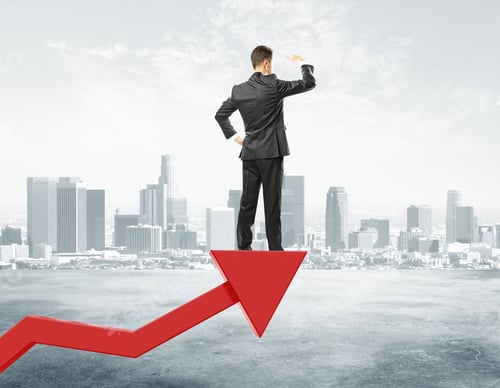 Preview: Businessman Staying On Big Red Arrow And Looking Into The Distance At City Background