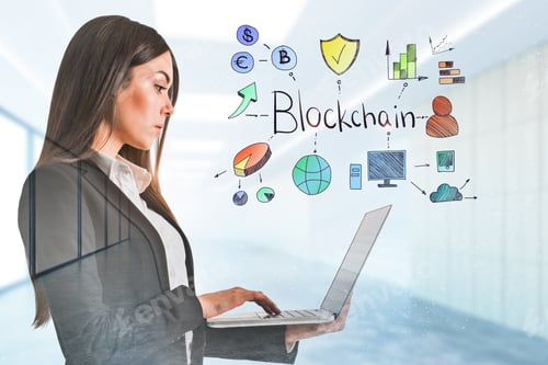 Preview: Attractive Young Businesswoman Using Laptop In Modern Blurry Office Interior With Blockchain