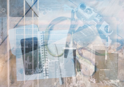 Preview: Top View Of Desktop With Camera, Smartphone And Notepad On Abstract City Concept. Hobby Concept